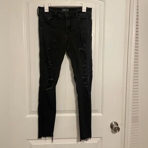Black skinny jeans w/cutout rips